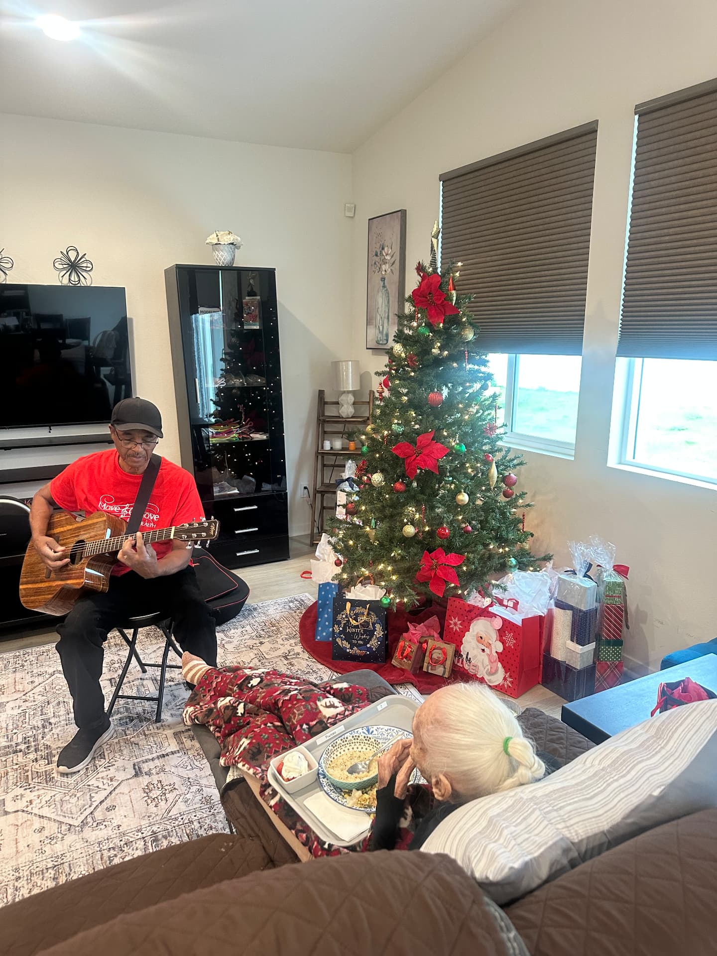 Live guitar music in the living room during the holidays