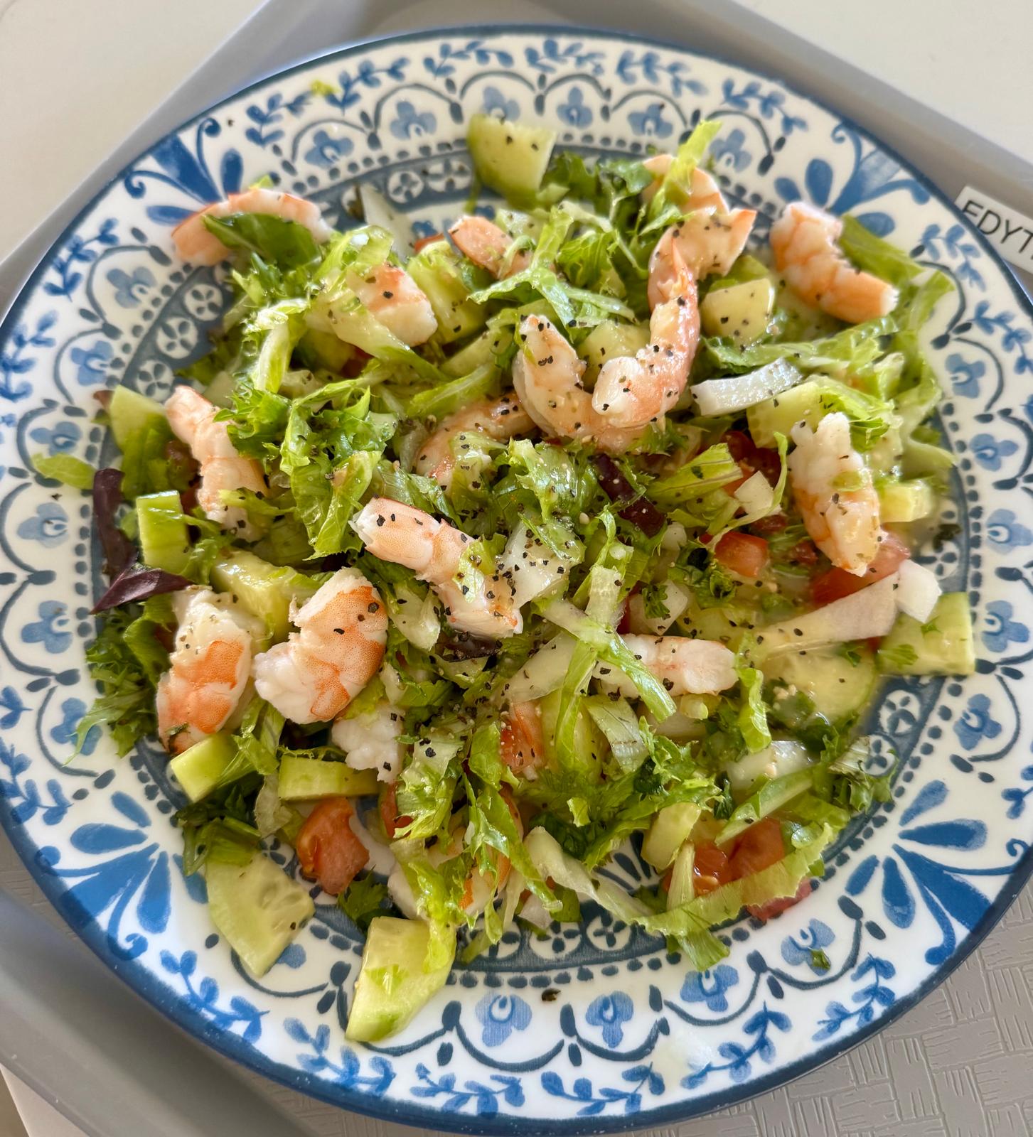 Fresh shrimp and vegetable salad plated for a resident lunch